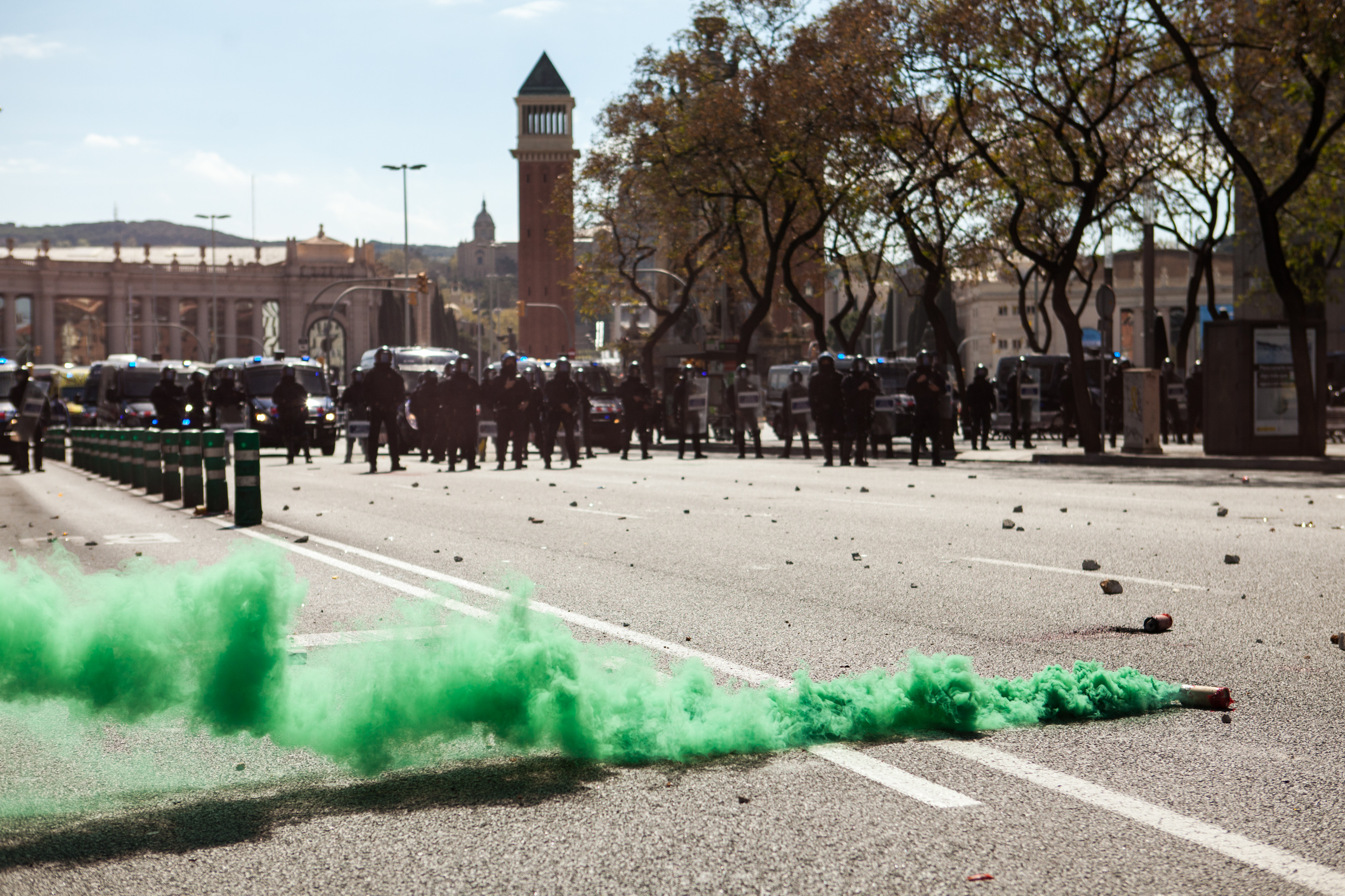 Antifascists throw stones to police trying to rich the far righ party. Barcelona