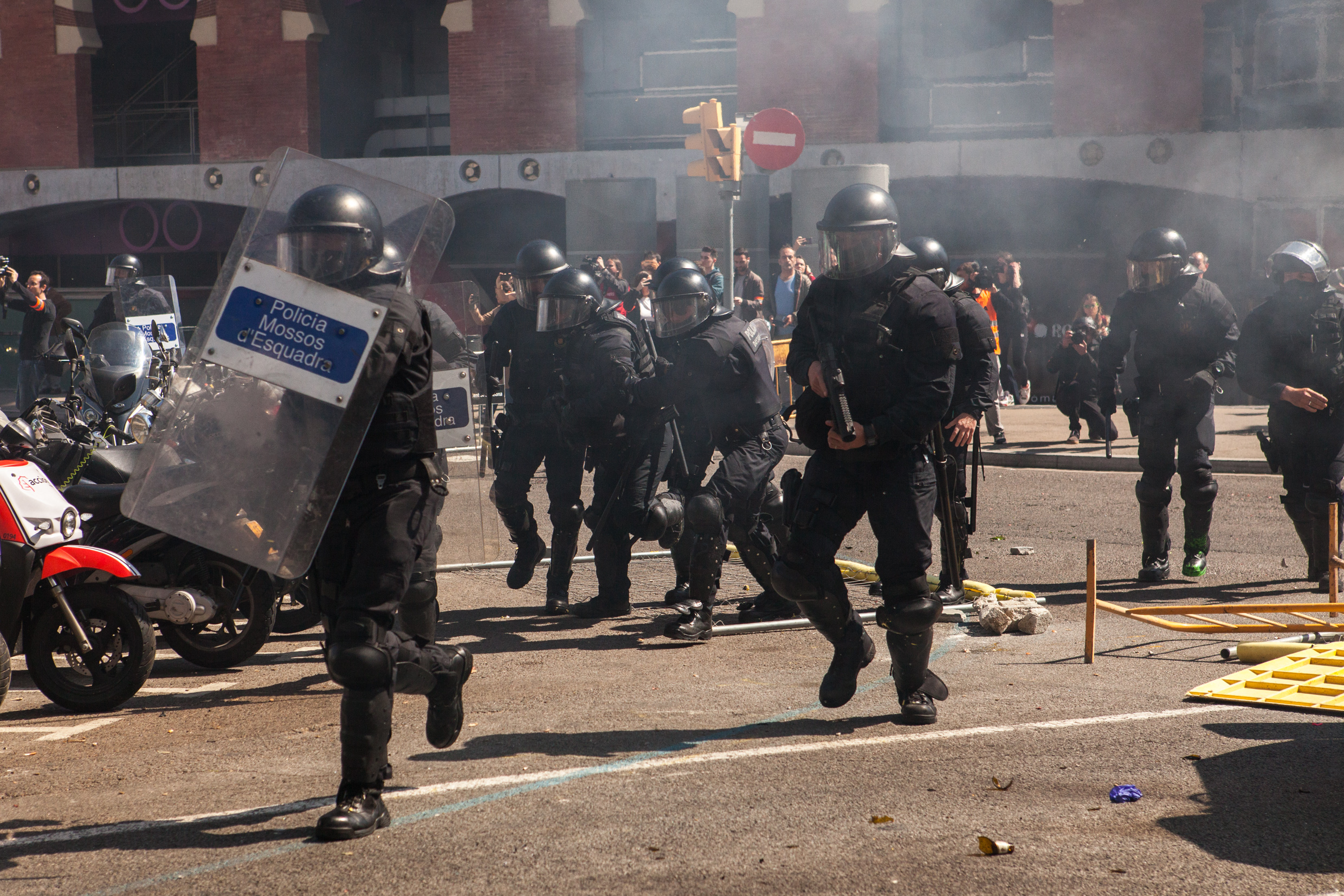 Catalan police charging the antifascist group. Barcelona