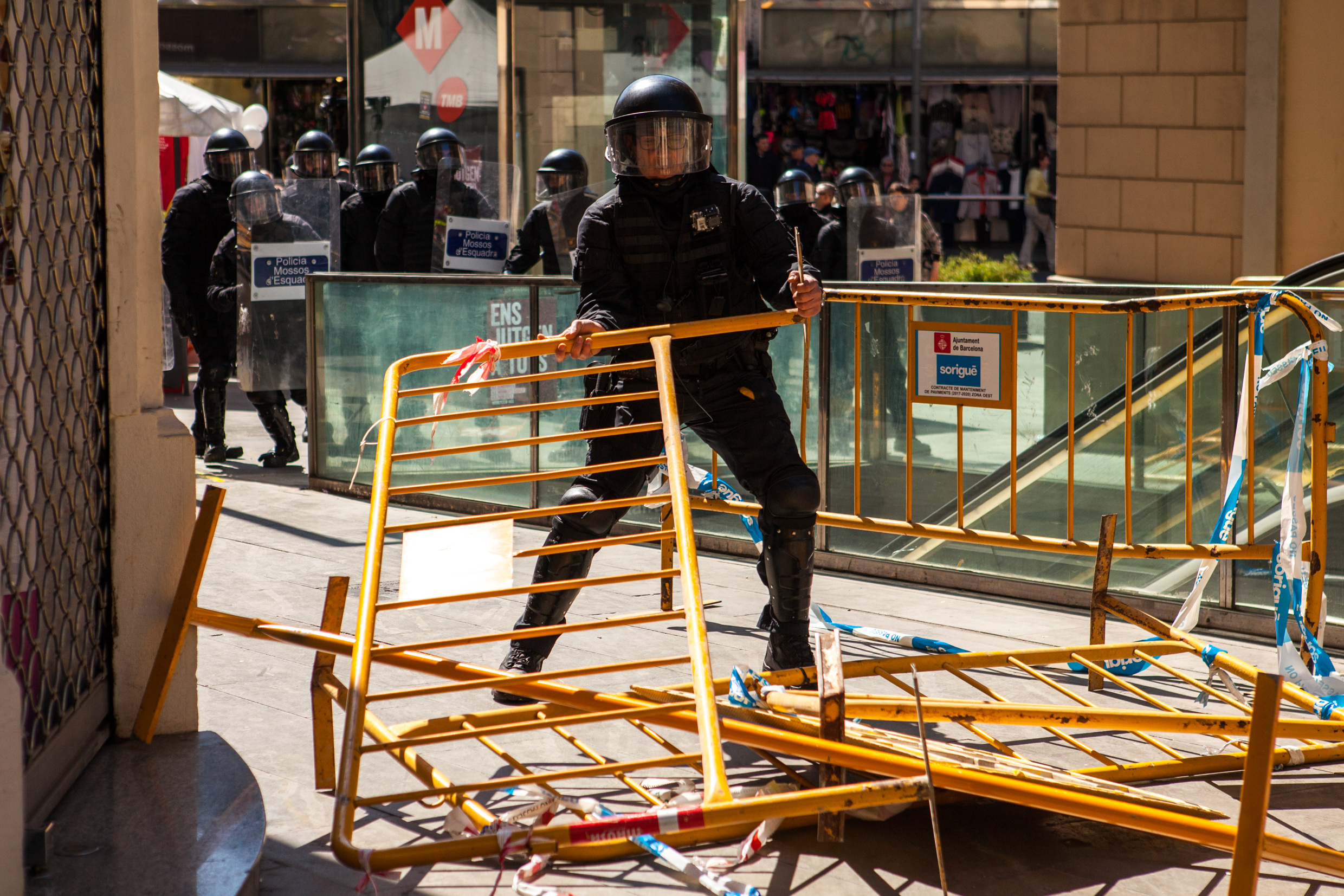 Catalan police cleaning the way from the barricate to charge the antifascist group. Barcelona