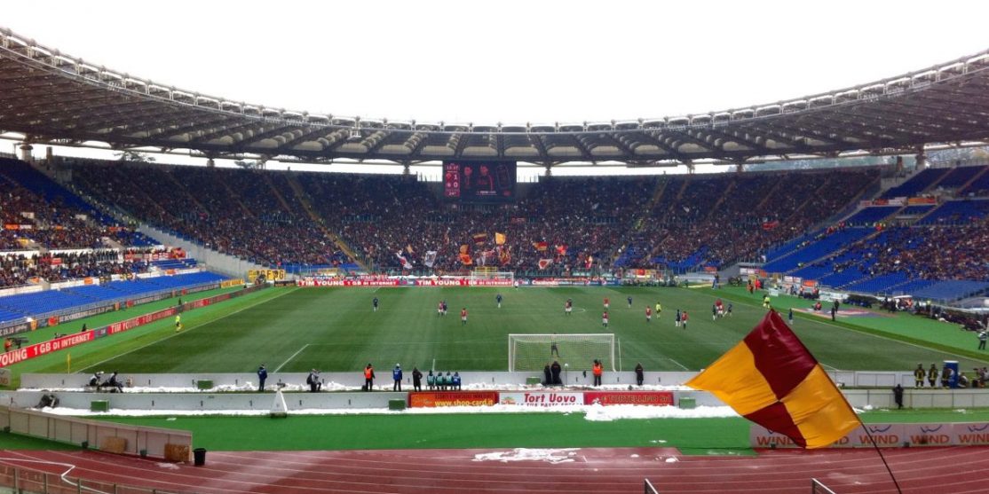 AS_Roma_fans_at_Stadio_Olimpico_during_Roma-Inter-min