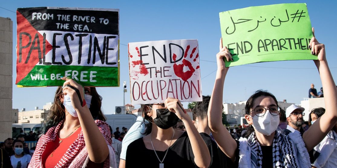 Protestors_Holding_Pro_Palestine_Posters